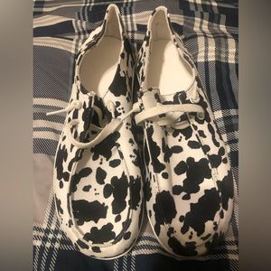Woman’s cow print slip-ons